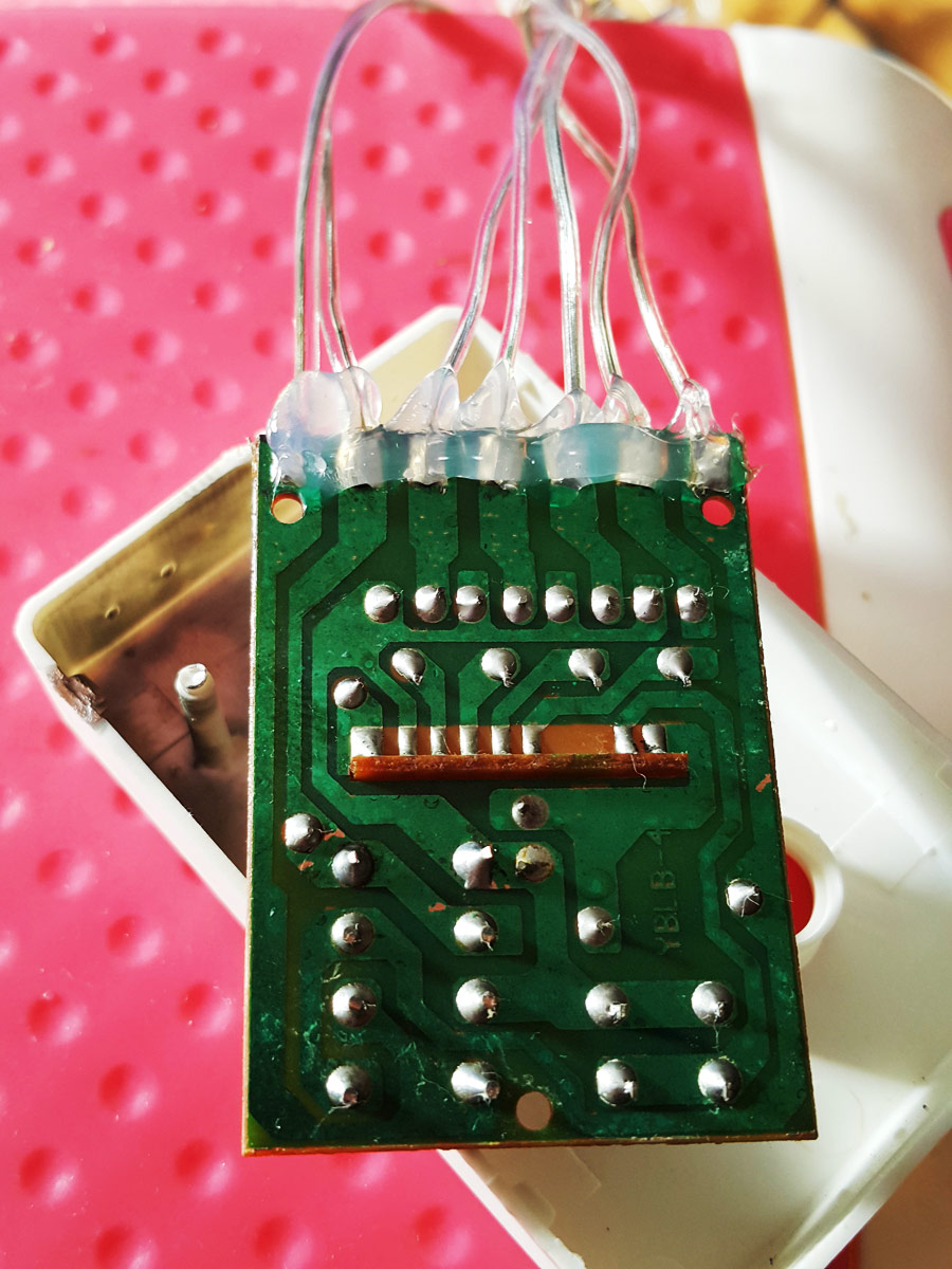 The newly soldered and cleaned wire connections covered liberally with hot glue for strain relief.