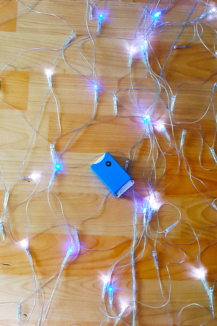 The repaired Christmas lights plugged in and successfully lit up.