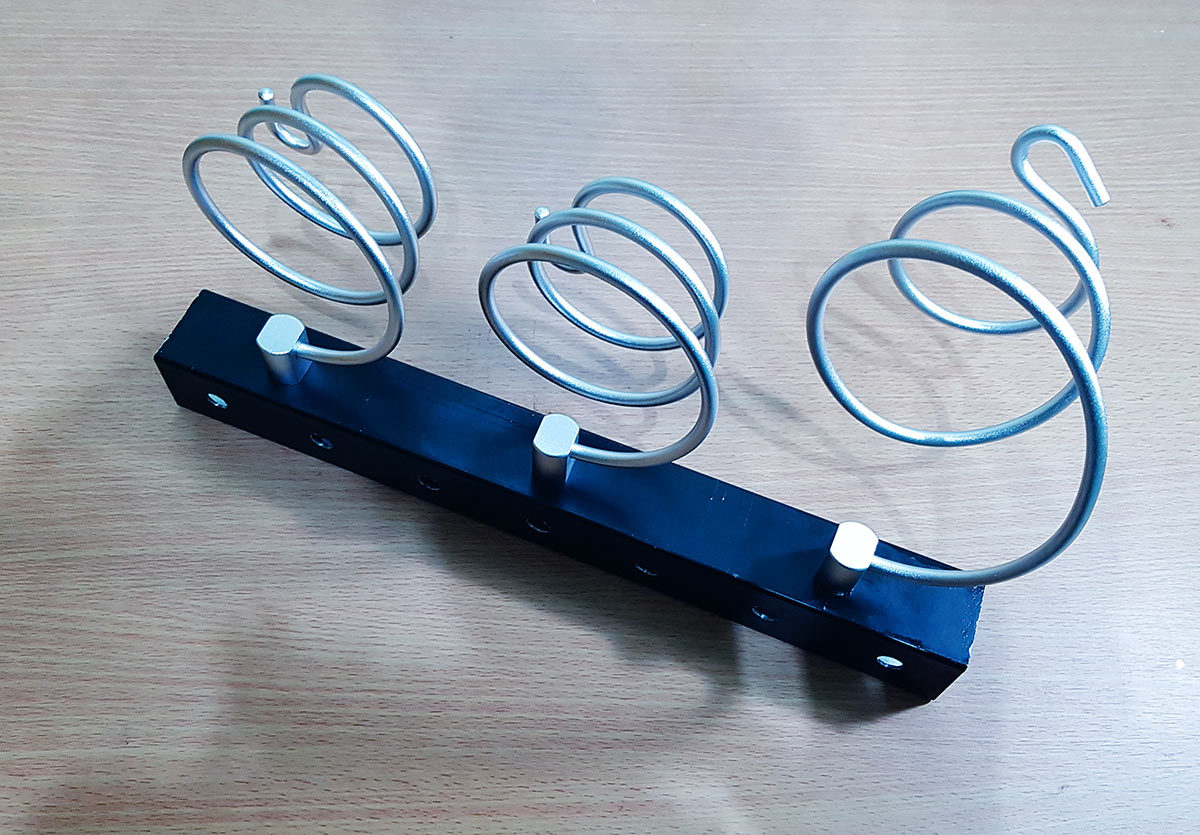 The custom-made bracket using 40x40 square pipe and the holders attached.