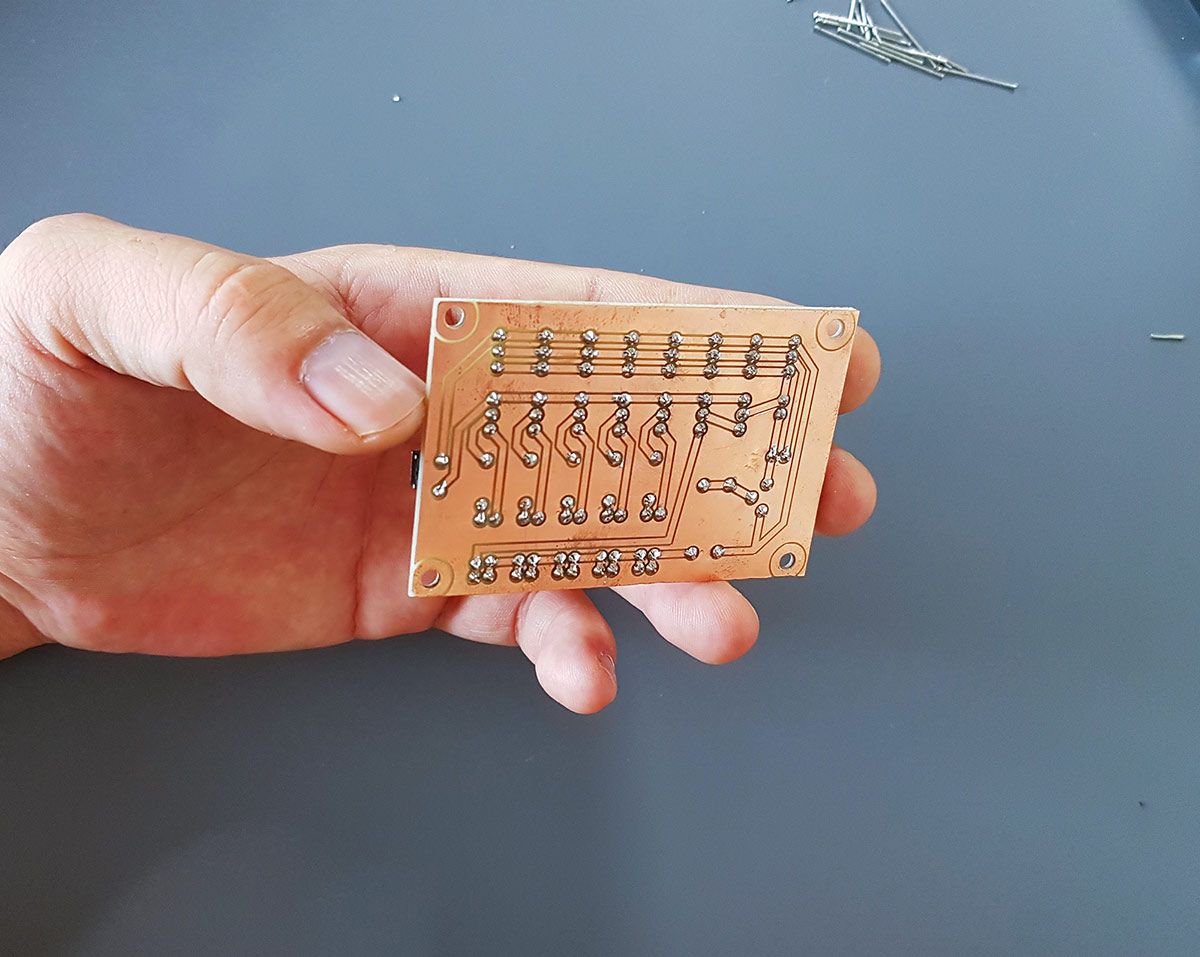 Back side of the DIY PCB showing the hand-soldered joints.