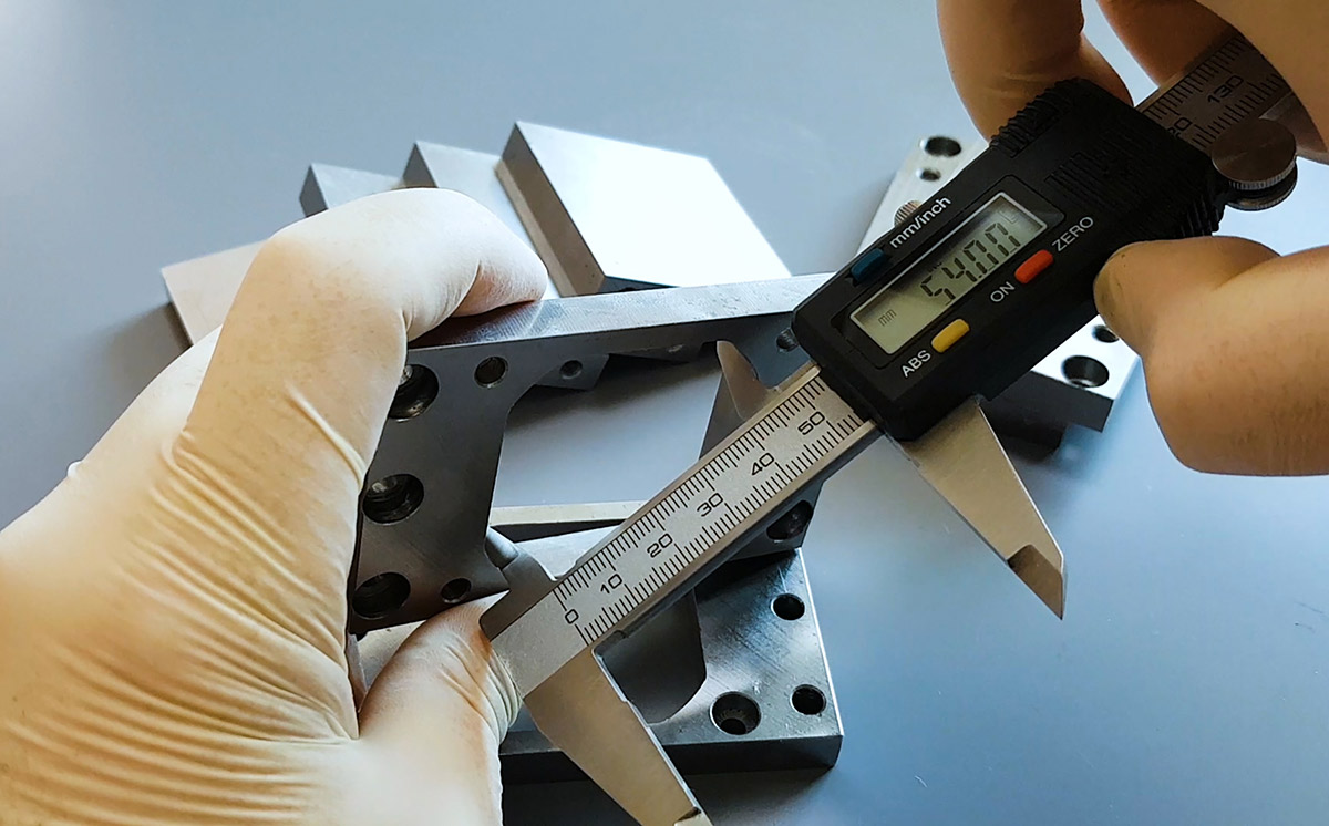 Checking the internal dimension of the machined mount.